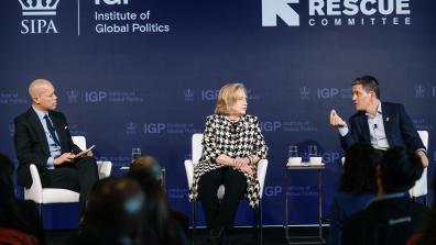 Vladimir Duthiers, Secretary Hillary Rodham Clinton, and David Miliband appeared at an IGP event on December 18.
