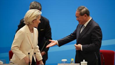 Chinese Premier Li Qiang (R) and European Commission President Ursula von der Leyen (L) attend the EU-China Business Leaders Symposium at the the Great Hall of the People in Beijing.