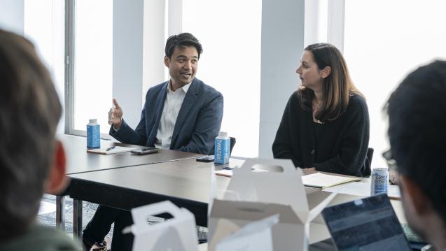 Zayn Siddique (left) and Betsy Ankney (right) confer during a workshop