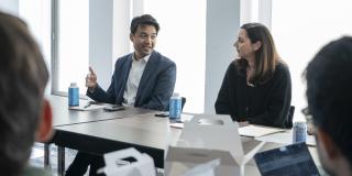 Zayn Siddique (left) and Betsy Ankney (right) confer during a workshop